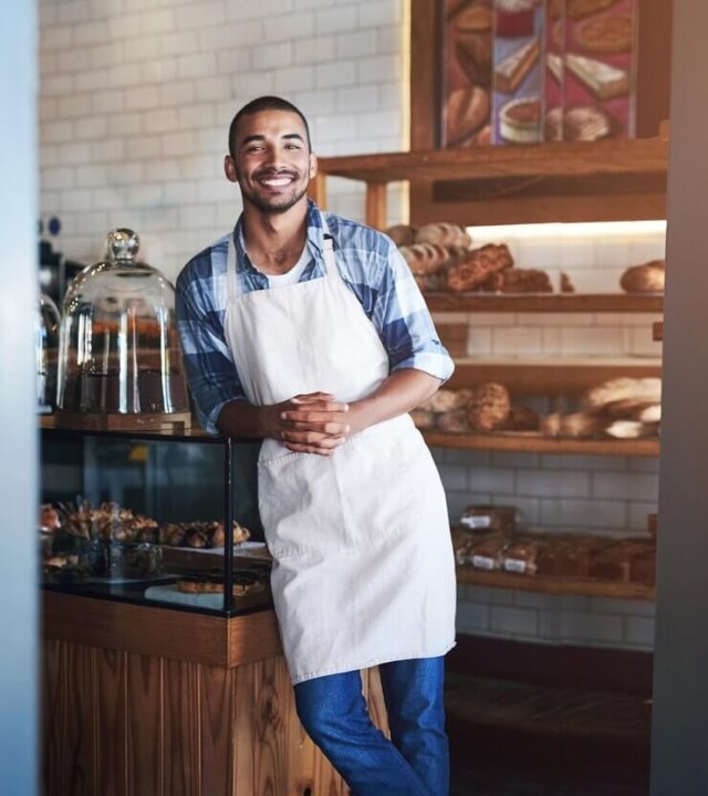 bakery-cafe-owner-business-portrait-smile-small-scale-restaurant-service-kitchen-pastry-baker-entrepreneur-hospitality-shop-male-person-food-industry_590464-355151